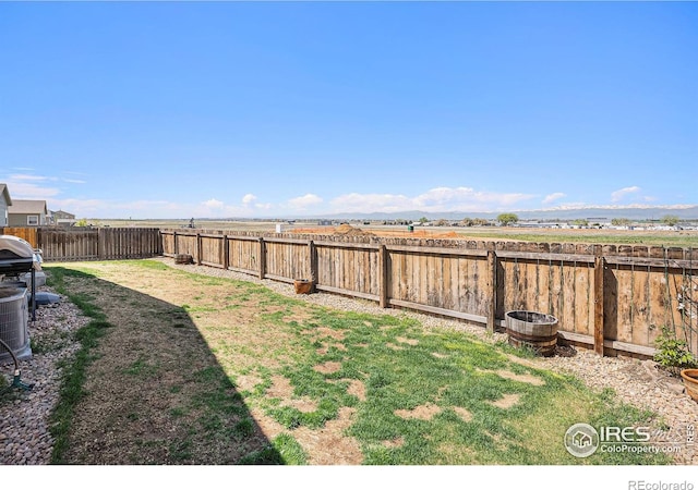view of yard with a fenced backyard