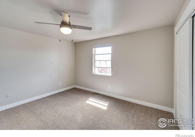 221 Chestnut St, Windsor, CO 80550 - spare room featuring carpet, baseboards, and a ceiling fan
