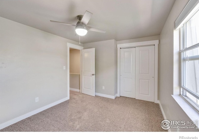 221 Chestnut St, Windsor, CO 80550 - unfurnished bedroom featuring carpet flooring, multiple windows, baseboards, and a closet