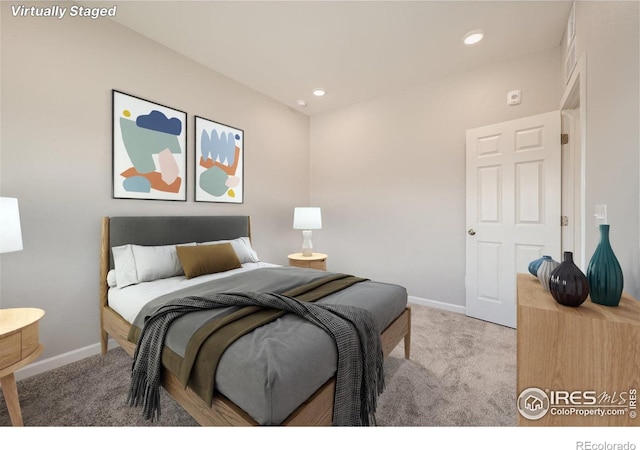 bedroom featuring baseboards, carpet flooring, and recessed lighting