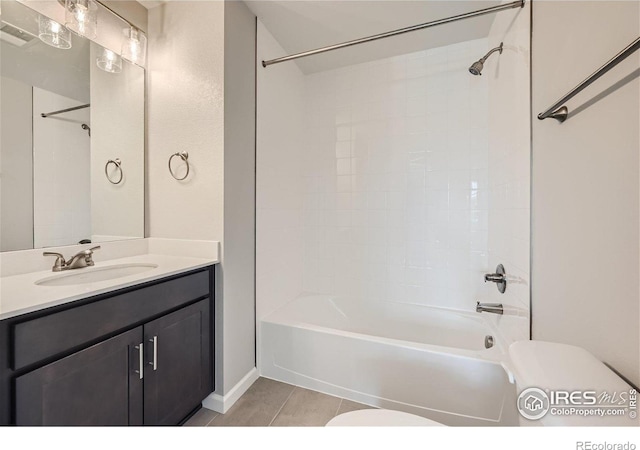 full bathroom featuring vanity, tile patterned floors, bathtub / shower combination, and toilet