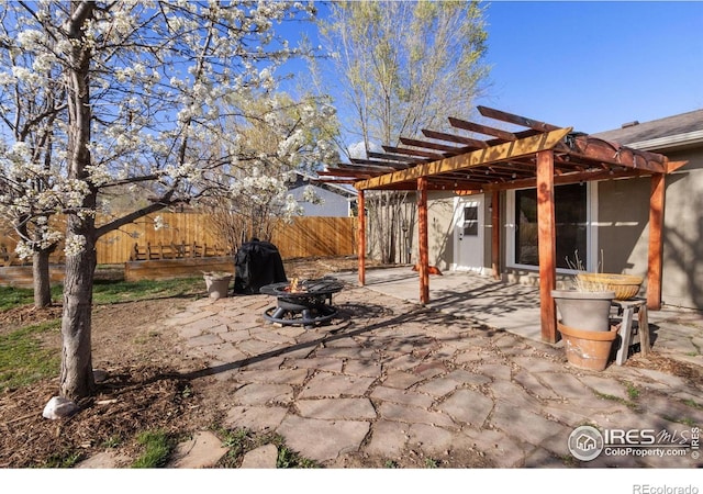 2139 Donna Ct, Loveland, CO 80537 - view of patio featuring a fire pit, fence, and a pergola