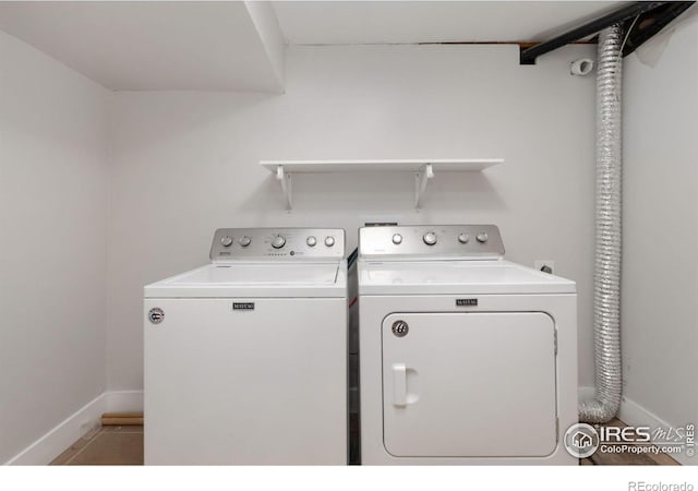 2139 Donna Ct, Loveland, CO 80537 - clothes washing area featuring baseboards, laundry area, tile patterned floors, and separate washer and dryer