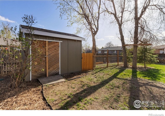 2139 Donna Ct, Loveland, CO 80537 - view of yard with fence, an outdoor structure, and a storage unit