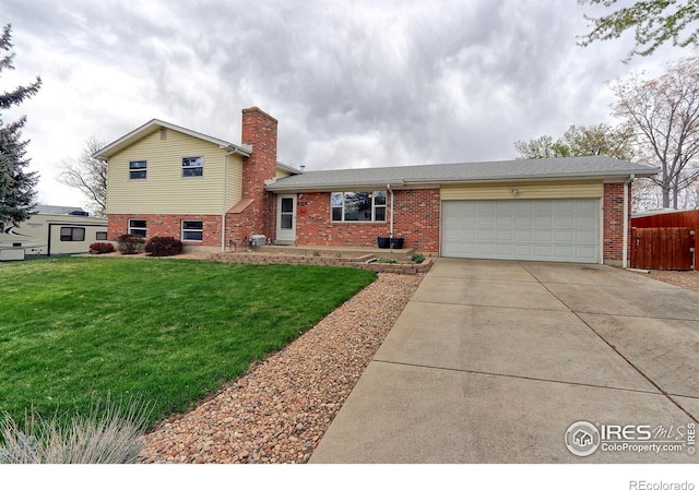 10538 Quivas St, Northglenn, CO 80234 - split level home with brick siding, driveway, an attached garage, and a chimney