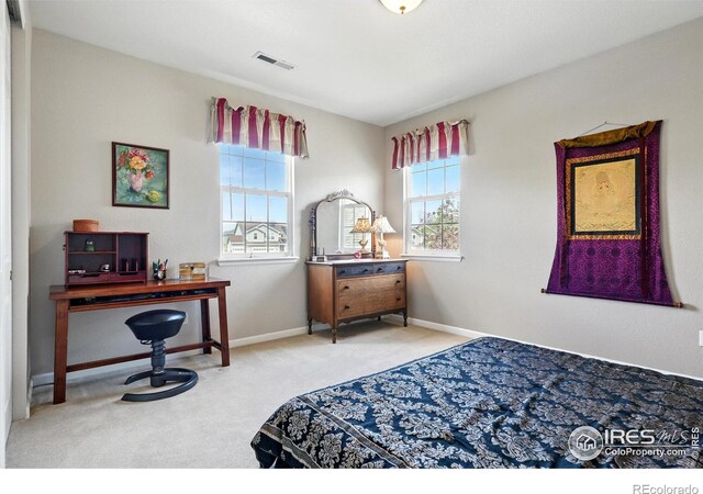 665 Glenarbor Cir, Longmont, CO 80504 - bedroom with carpet floors, baseboards, and visible vents