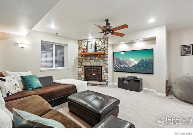 665 Glenarbor Cir, Longmont, CO 80504 - carpeted living room featuring visible vents, baseboards, a stone fireplace, recessed lighting, and a ceiling fan
