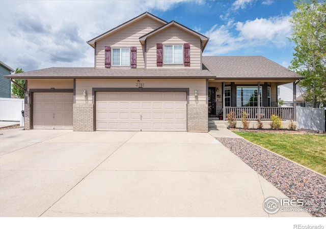 view of front of home featuring a porch, brick siding, fence, concrete driveway, and an attached garage
