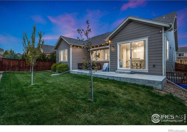 719 Wagon Bend Rd, Berthoud, CO 80513 - back of house featuring a patio, fence, and a yard