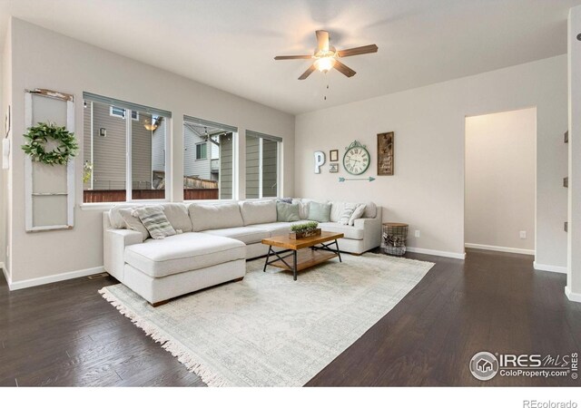 719 Wagon Bend Rd, Berthoud, CO 80513 - living area featuring a ceiling fan, baseboards, and dark wood-type flooring
