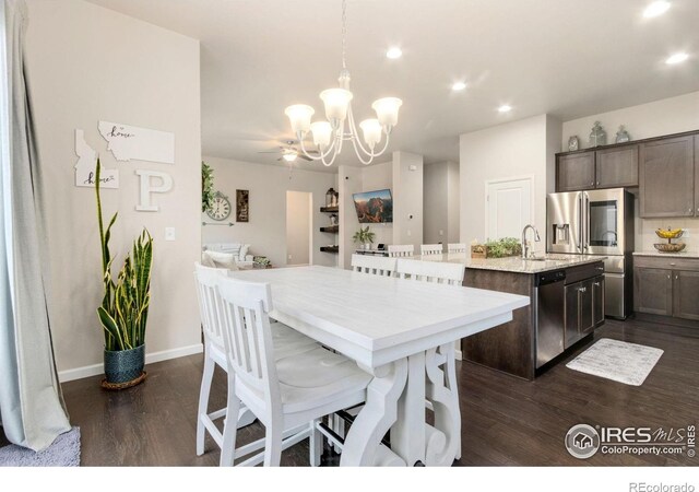 719 Wagon Bend Rd, Berthoud, CO 80513 - dining room featuring baseboards, recessed lighting, dark wood-style flooring, and a chandelier