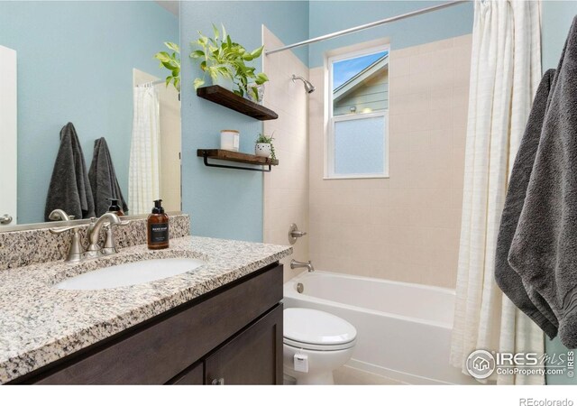 719 Wagon Bend Rd, Berthoud, CO 80513 - bathroom with shower / bath combo with shower curtain, toilet, and vanity