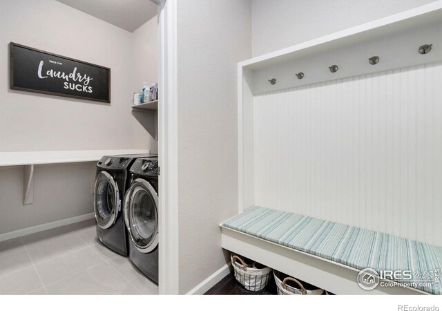 719 Wagon Bend Rd, Berthoud, CO 80513 - laundry room featuring separate washer and dryer, laundry area, baseboards, and tile patterned floors