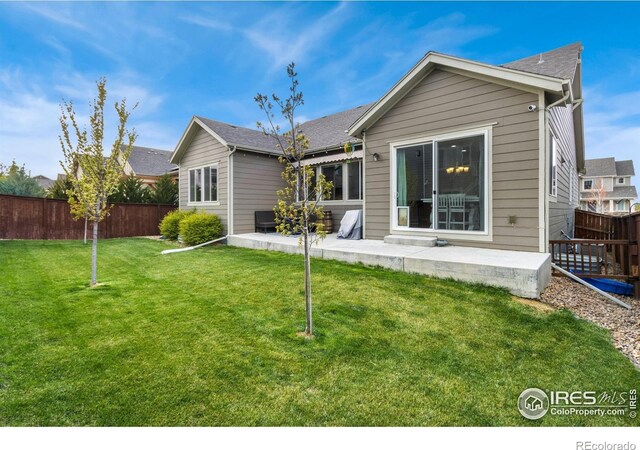 719 Wagon Bend Rd, Berthoud, CO 80513 - back of house featuring a yard, a patio, and fence