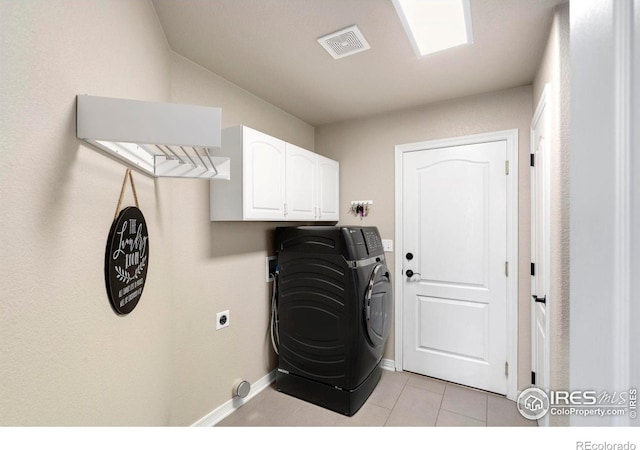 5442 Tiller Ct, Windsor, CO 80528 - washroom with washer / clothes dryer, visible vents, cabinet space, light tile patterned floors, and baseboards