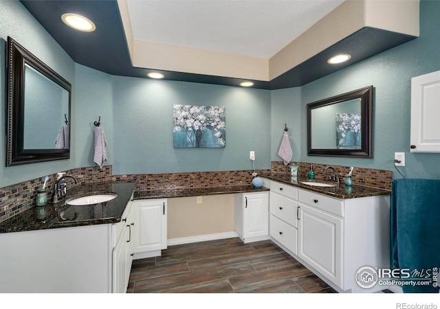 5442 Tiller Ct, Windsor, CO 80528 - bathroom featuring recessed lighting, wood finished floors, and tasteful backsplash