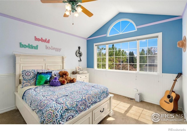 5442 Tiller Ct, Windsor, CO 80528 - bedroom featuring vaulted ceiling, visible vents, wainscoting, and light colored carpet