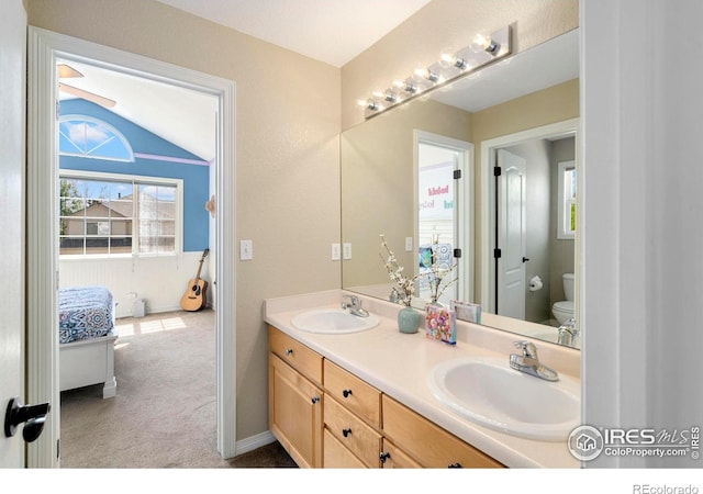 5442 Tiller Ct, Windsor, CO 80528 - full bathroom with double vanity, toilet, a sink, and connected bathroom