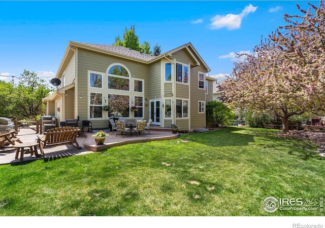 5442 Tiller Ct, Windsor, CO 80528 - back of property featuring a patio and a yard