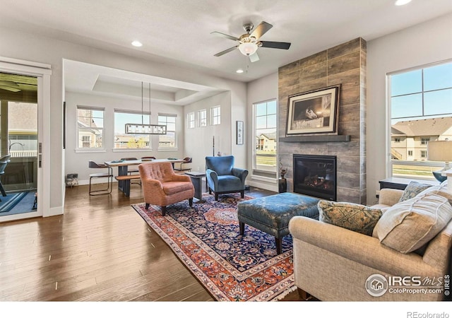 3558 Prickly Pear Dr, Loveland, CO 80537 - living room with ceiling fan, a fireplace, recessed lighting, baseboards, and wood finished floors