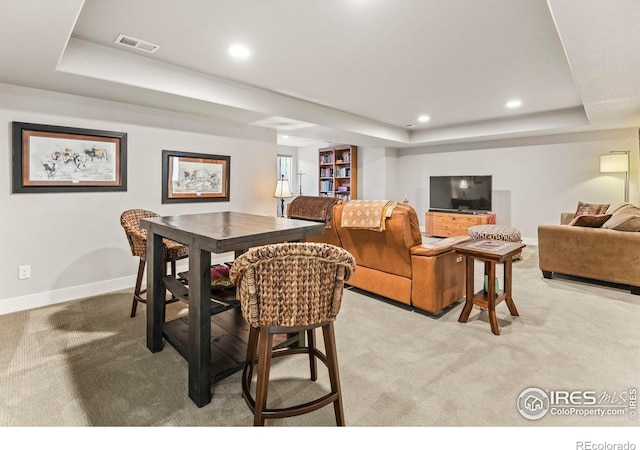 3558 Prickly Pear Dr, Loveland, CO 80537 - dining space featuring light colored carpet, a tray ceiling, visible vents, and baseboards