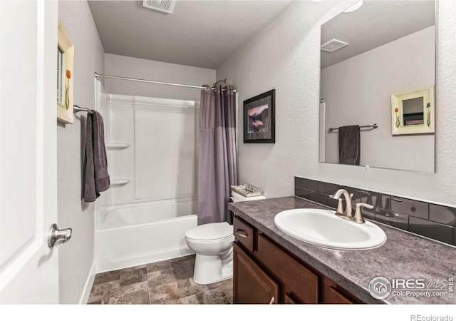 3558 Prickly Pear Dr, Loveland, CO 80537 - bathroom featuring toilet, visible vents, stone finish floor, and vanity
