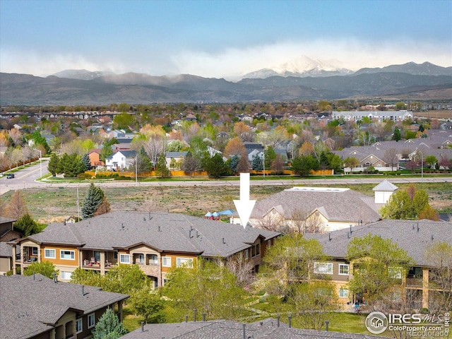 aerial perspective of suburban area featuring a mountain backdrop