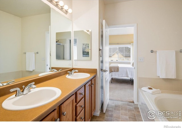 full bath with double vanity, a bath, and connected bathroom