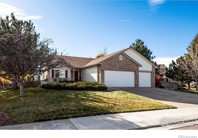 single story home featuring a garage, concrete driveway, a front lawn, and brick siding