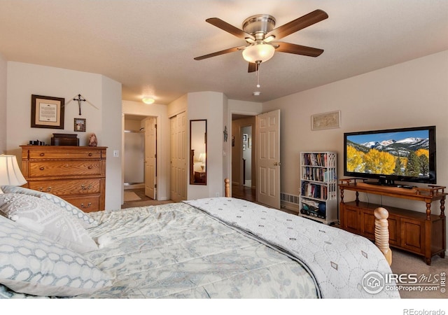 carpeted bedroom featuring a ceiling fan
