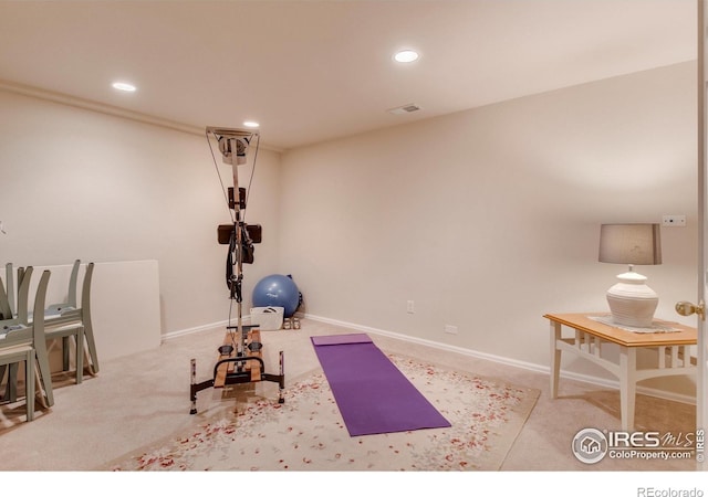 exercise area featuring carpet floors, baseboards, recessed lighting, and visible vents