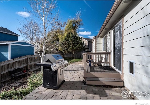 exterior space featuring grilling area and a fenced backyard