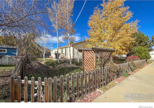 view of property exterior featuring fence private yard