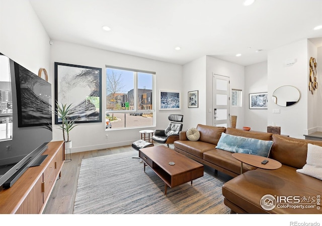 2907 32nd St, Boulder, CO 80301 - living room with recessed lighting, light wood-type flooring, and baseboards