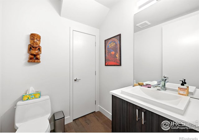 2907 32nd St, Boulder, CO 80301 - half bath featuring wood finished floors, toilet, vanity, and baseboards