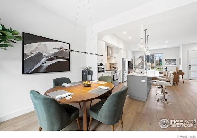2907 32nd St, Boulder, CO 80301 - dining space featuring light wood-type flooring, recessed lighting, and baseboards