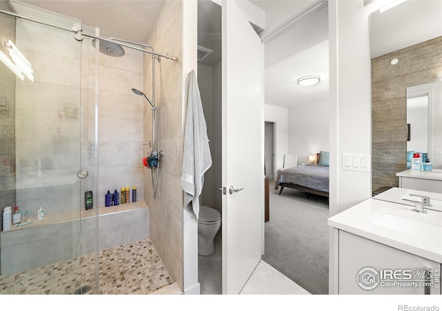 2907 32nd St, Boulder, CO 80301 - ensuite bathroom featuring a stall shower, vanity, and toilet