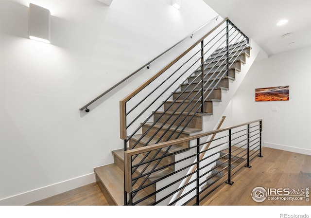 2907 32nd St, Boulder, CO 80301 - staircase featuring baseboards, wood finished floors, and recessed lighting