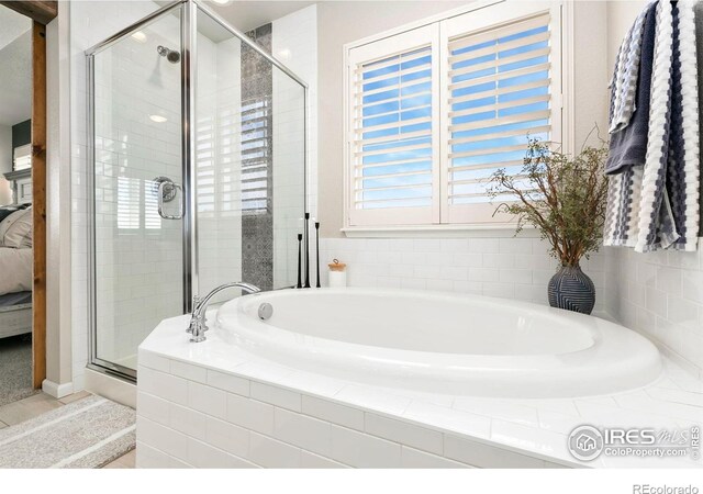 1977 Shadow Lake Ct, Windsor, CO 80550 - bathroom with a garden tub, a shower stall, and ensuite bathroom