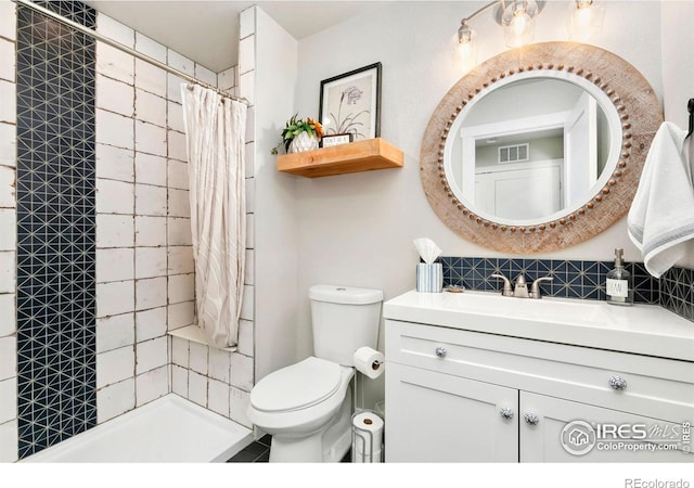 1977 Shadow Lake Ct, Windsor, CO 80550 - full bath featuring vanity, toilet, tasteful backsplash, and tiled shower