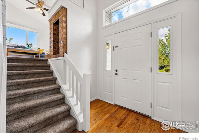 3812 Howe Ct, Boulder, CO 80301 - foyer featuring wood finished floors, stairs, a ceiling fan, baseboards, and vaulted ceiling