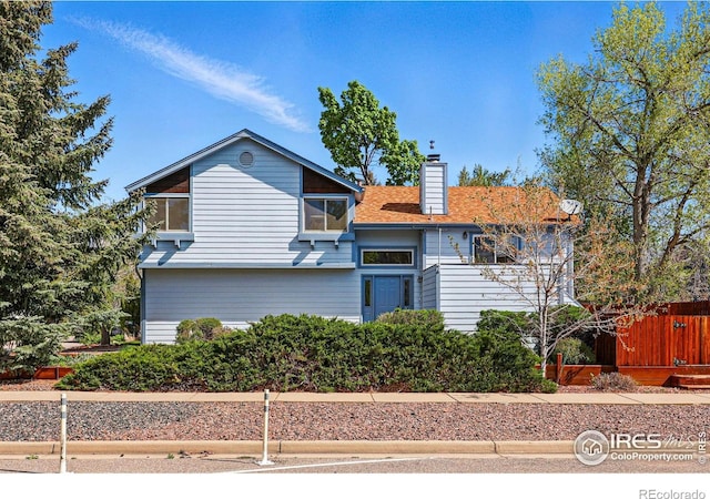 3812 Howe Ct, Boulder, CO 80301 - view of front of property with a chimney and fence