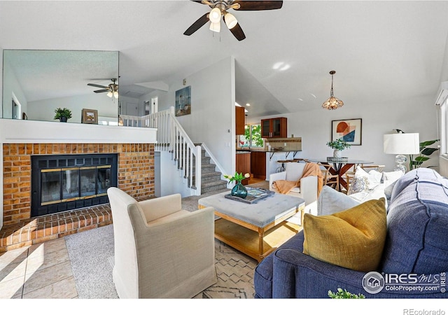 3812 Howe Ct, Boulder, CO 80301 - living area with vaulted ceiling, a ceiling fan, a brick fireplace, and stairway
