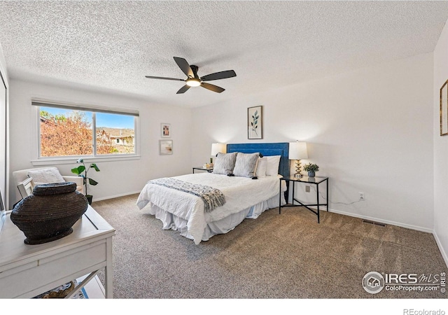 3812 Howe Ct, Boulder, CO 80301 - carpeted bedroom with a textured ceiling, baseboards, and a ceiling fan