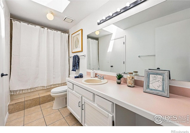 3812 Howe Ct, Boulder, CO 80301 - full bathroom featuring a skylight, tile patterned flooring, vanity, toilet, and a shower with shower curtain
