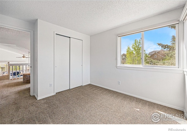 3812 Howe Ct, Boulder, CO 80301 - unfurnished bedroom featuring carpet floors, a textured ceiling, a closet, and baseboards