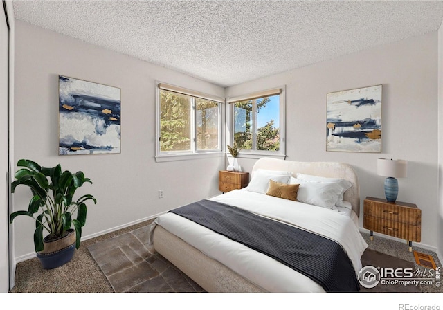 3812 Howe Ct, Boulder, CO 80301 - bedroom with carpet flooring, baseboards, and a textured ceiling