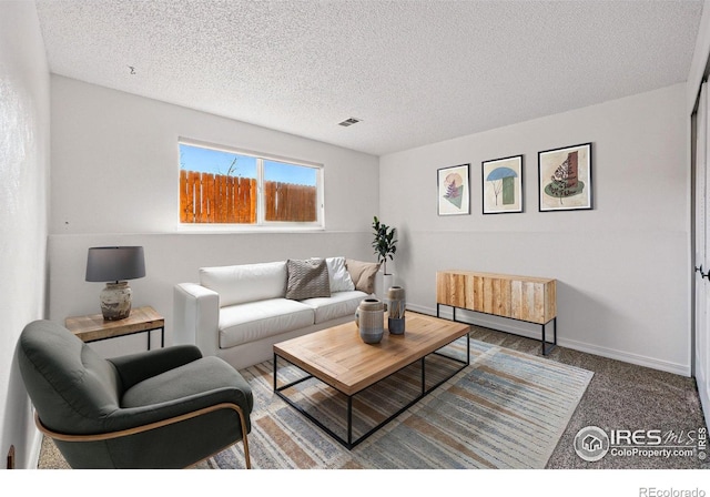 3812 Howe Ct, Boulder, CO 80301 - living area featuring a textured ceiling, carpet flooring, and baseboards