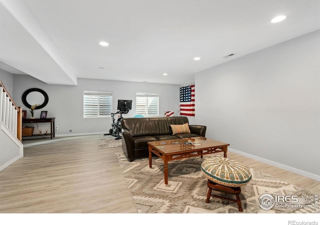 1689 Maseca Plaza Way, Severance, CO 80550 - living room featuring visible vents, light wood-style flooring, stairs, and recessed lighting