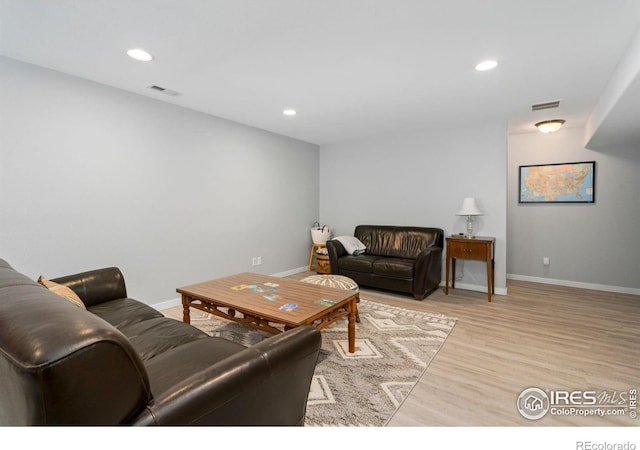 1689 Maseca Plaza Way, Severance, CO 80550 - living room featuring recessed lighting, baseboards, visible vents, and light wood-style flooring